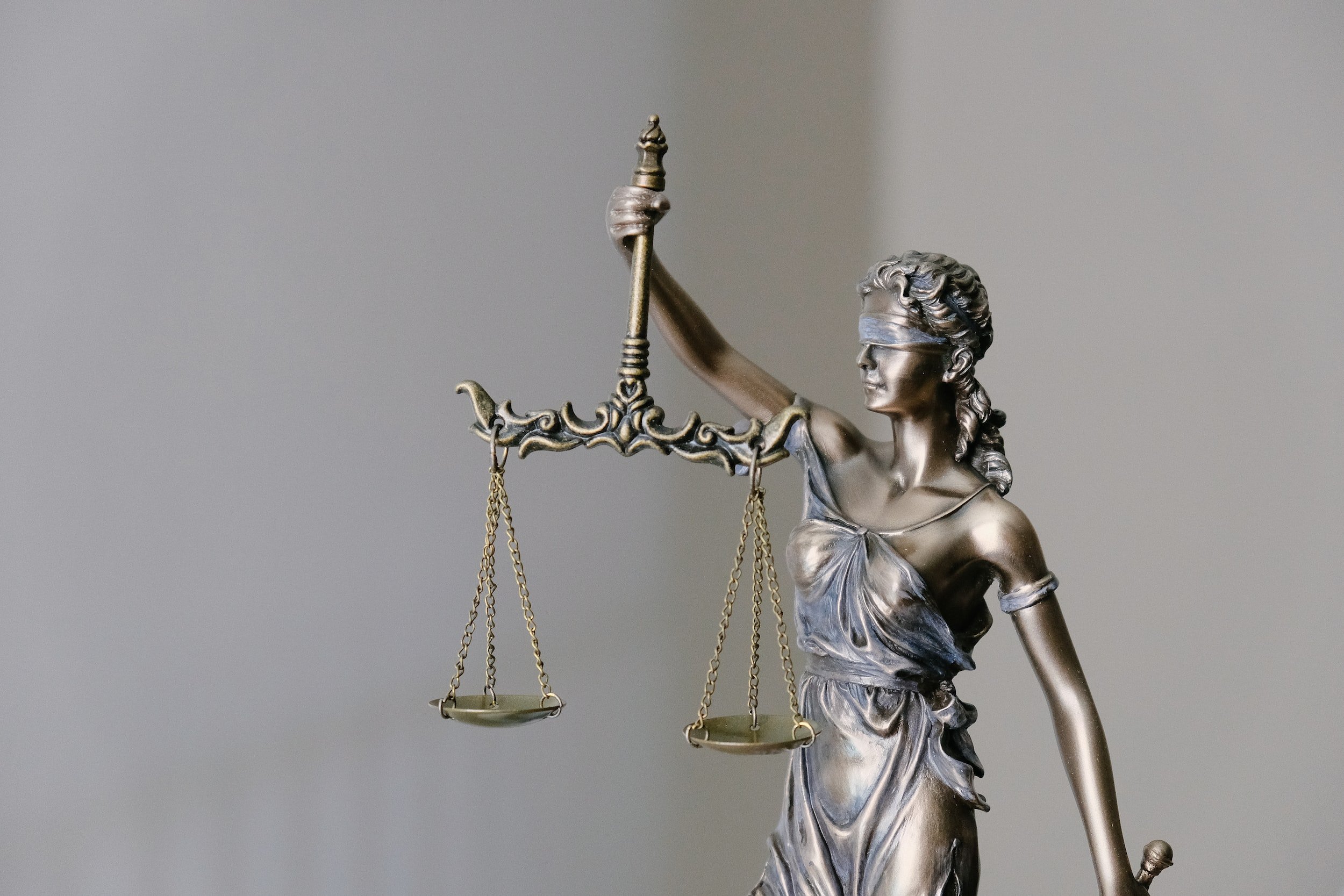 A statue of Lady Justice holding balanced scales